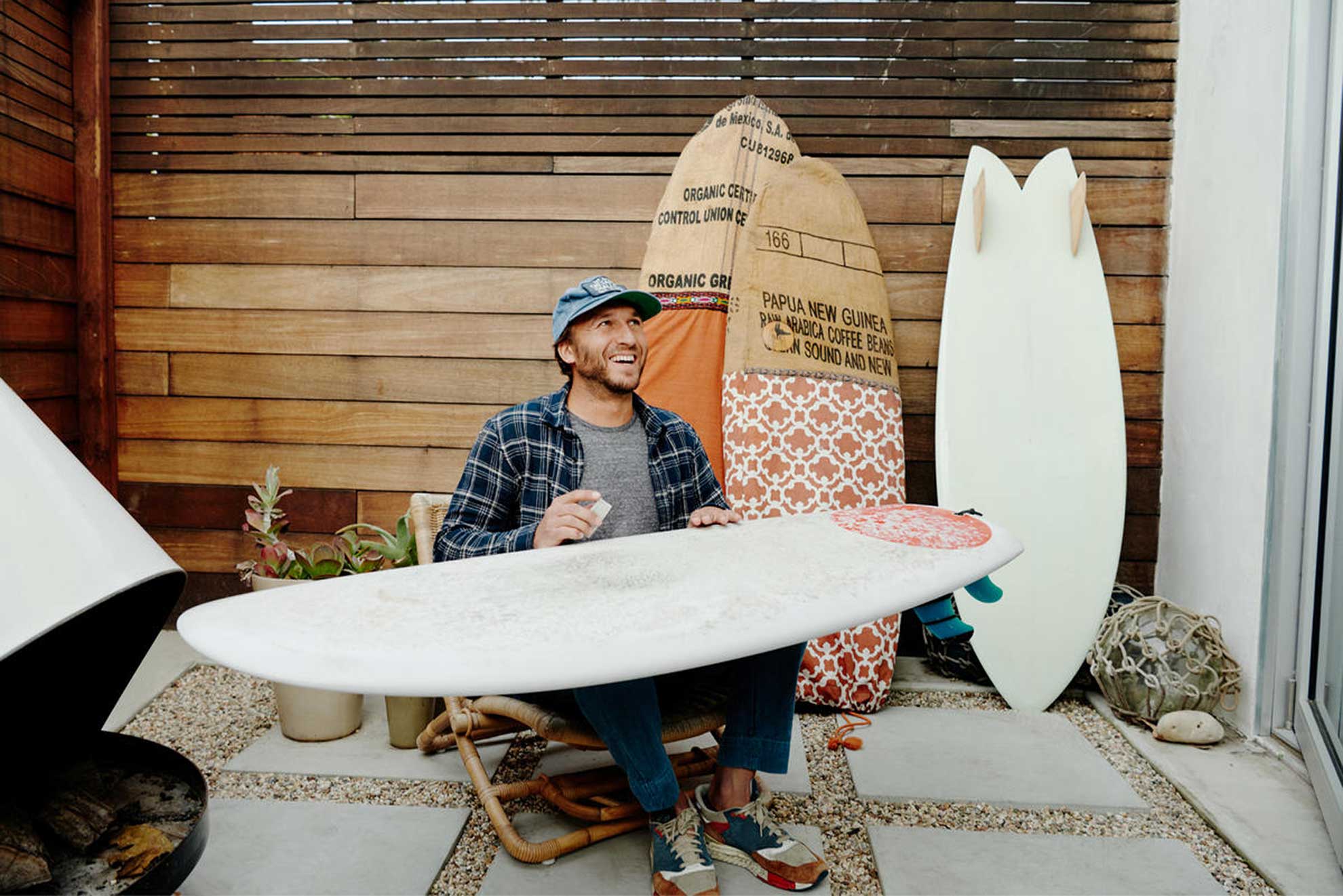 Airbnb host pictured with surf boards